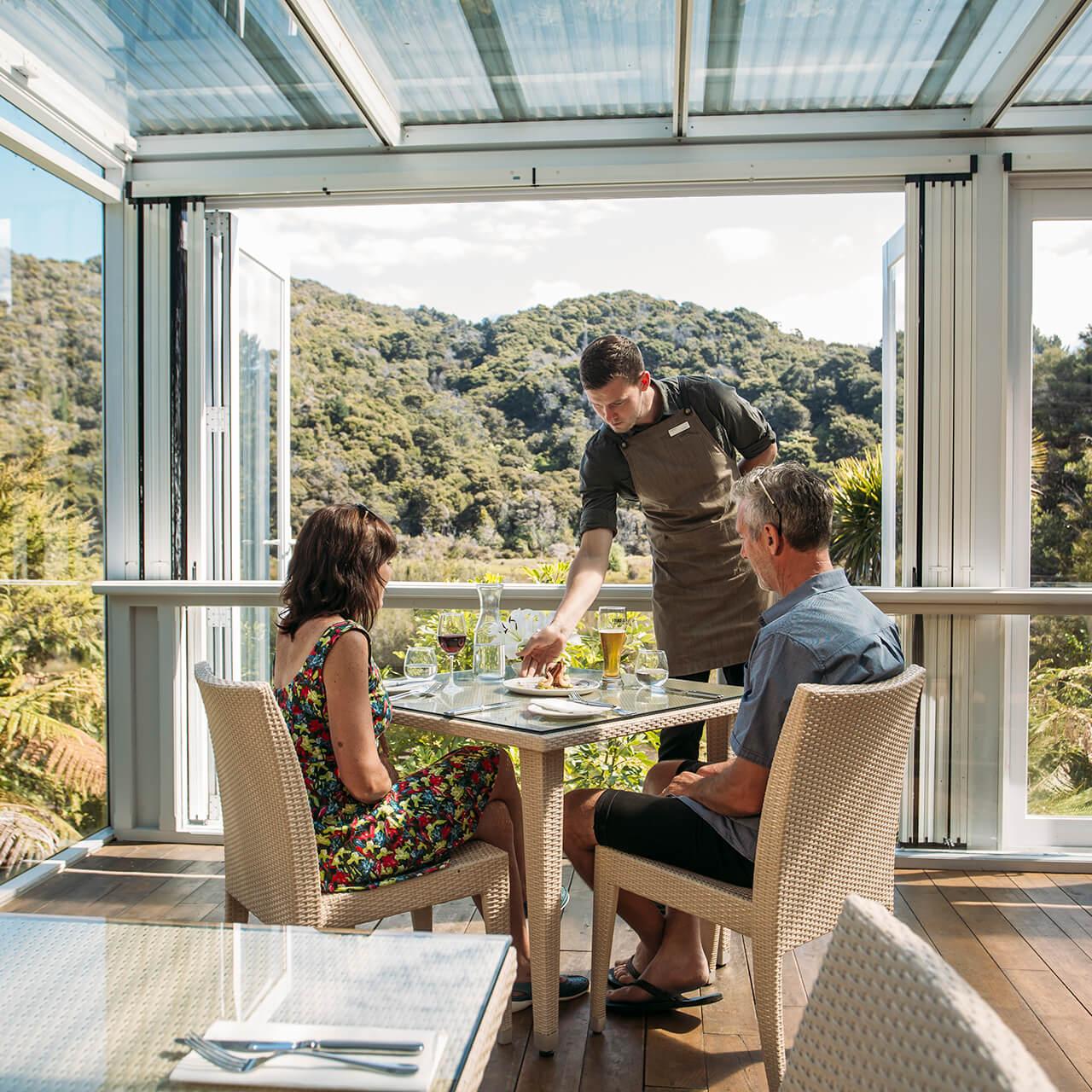 Couple Dining at Awaroa Lodge in Abel Tasman