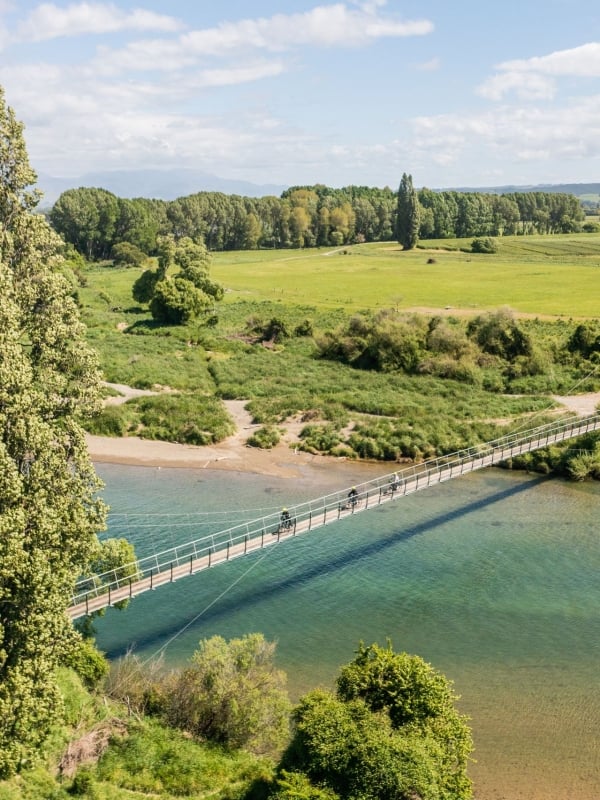 Cycling over the Baton River swing bridge (Lublow's Leap).