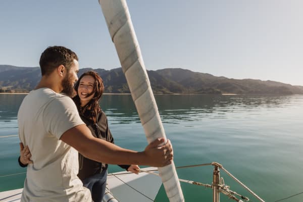 Zero carbon couple close up Abel Tasman Sailing