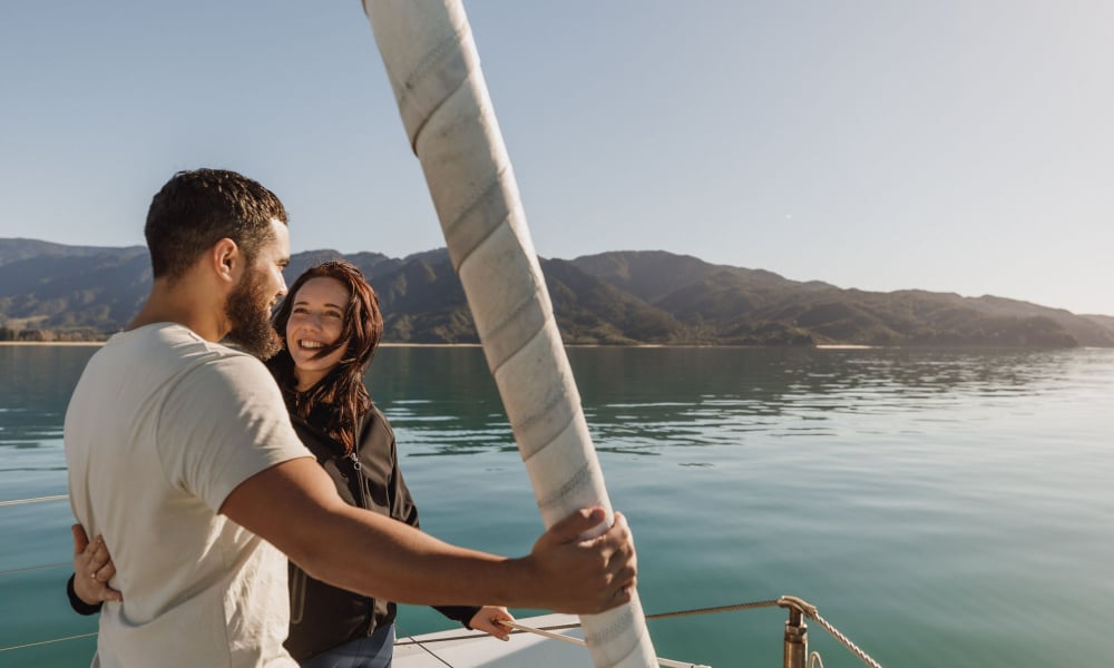 Zero carbon couple close up Abel Tasman Sailing