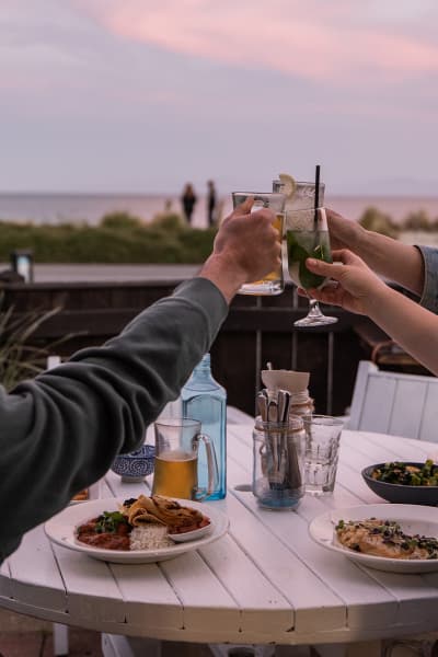 Tuck into fresh, local seafood at Hooked on Mārahau, a relaxed beachfront eatery with unbeatable views of the Abel Tasman coastline.