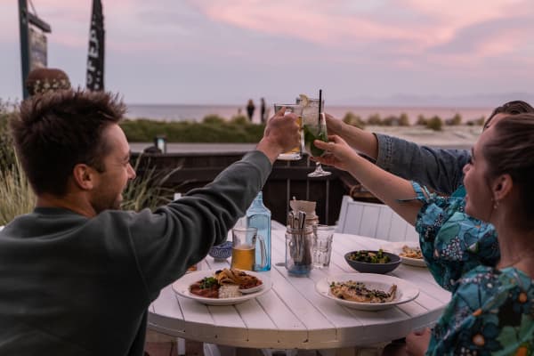 Tuck into fresh, local seafood at Hooked on Mārahau, a relaxed beachfront eatery with unbeatable views of the Abel Tasman coastline.