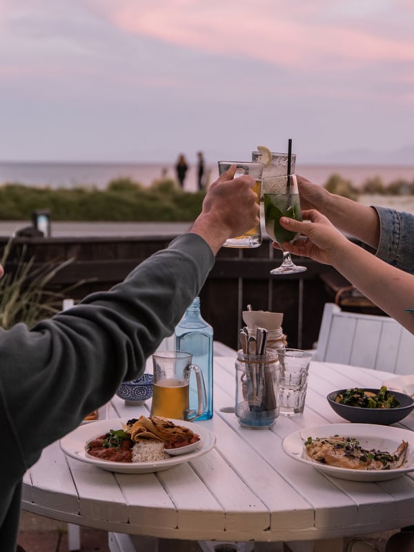 Tuck into fresh, local seafood at Hooked on Mārahau, a relaxed beachfront eatery with unbeatable views of the Abel Tasman coastline.