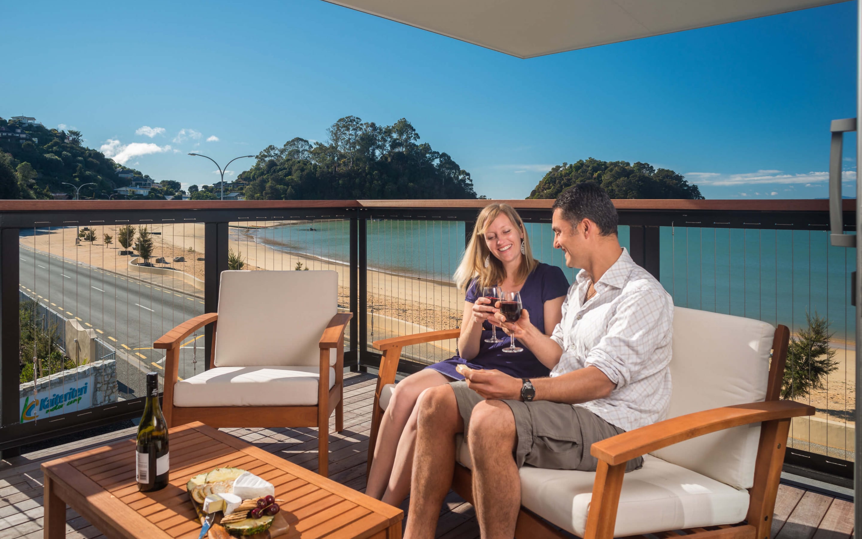 Kaiteriteri Recreation Reserve apartments couple cheers
