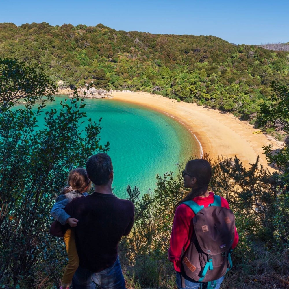 Family walking Abel Tasman National Park