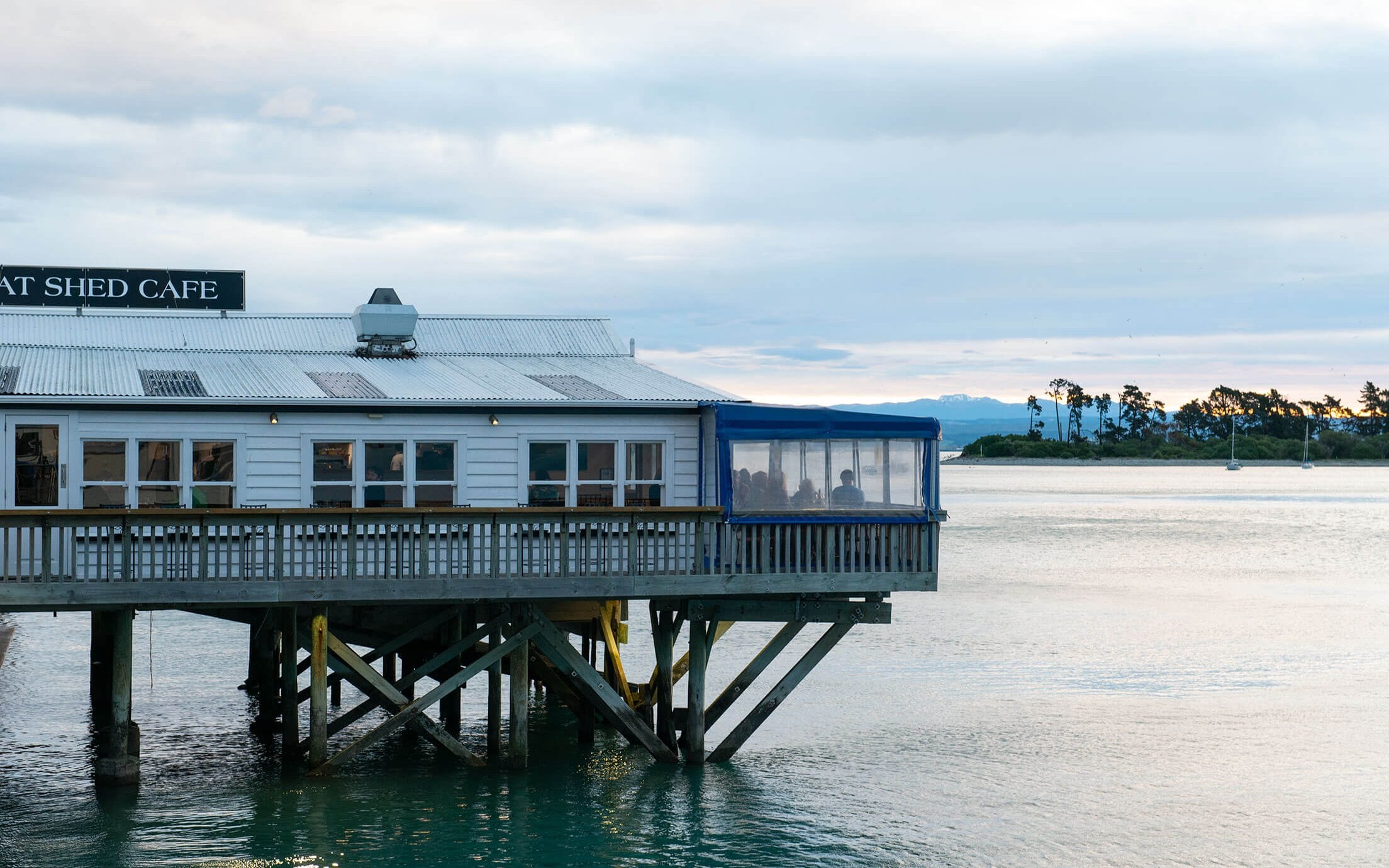 The Boat Shed sunset water by Sarah Tuck DISH Magazine