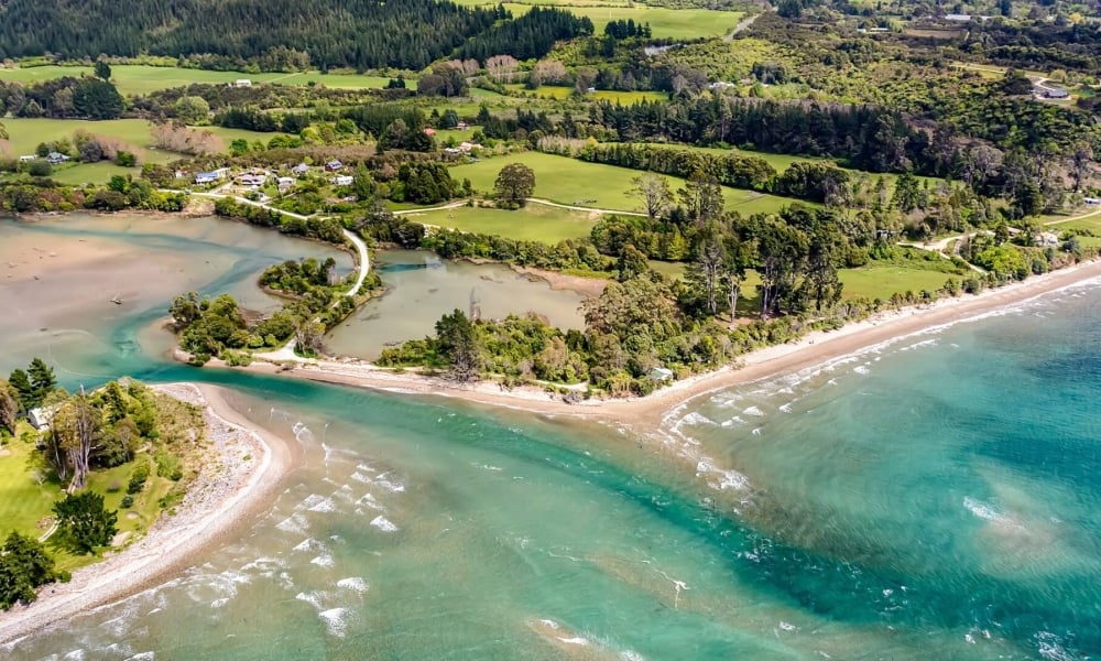 Soar over shimmering Parapara Inlet and the golden sands of Collingwood with Golden Bay Air