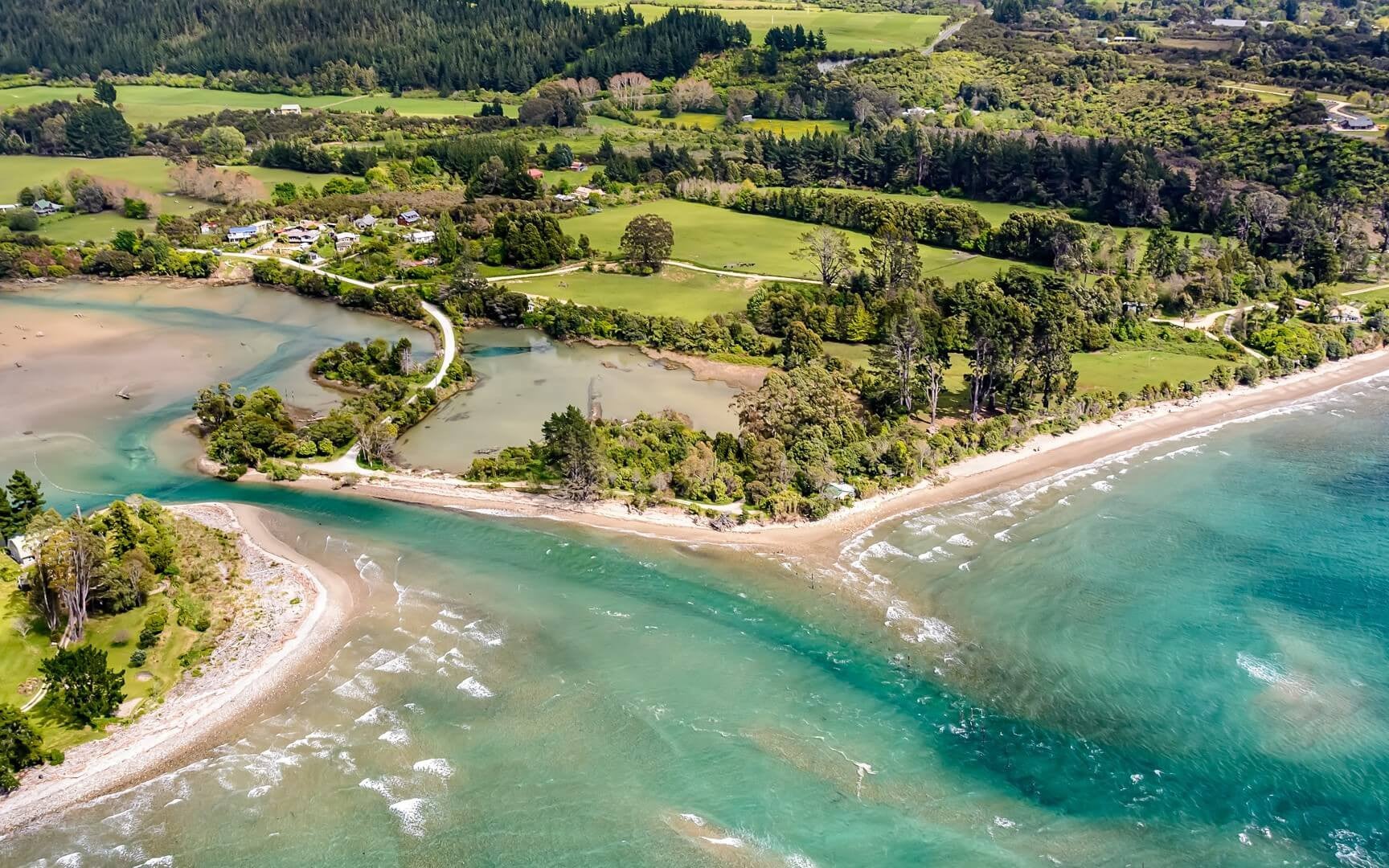 Soar over shimmering Parapara Inlet and the golden sands of Collingwood with Golden Bay Air