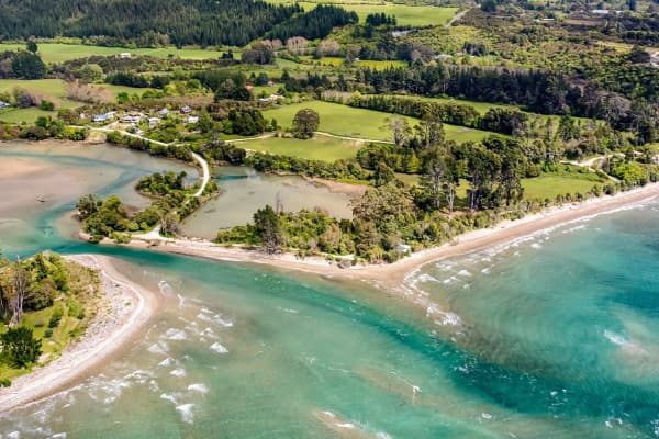 Soar over shimmering Parapara Inlet and the golden sands of Collingwood with Golden Bay Air