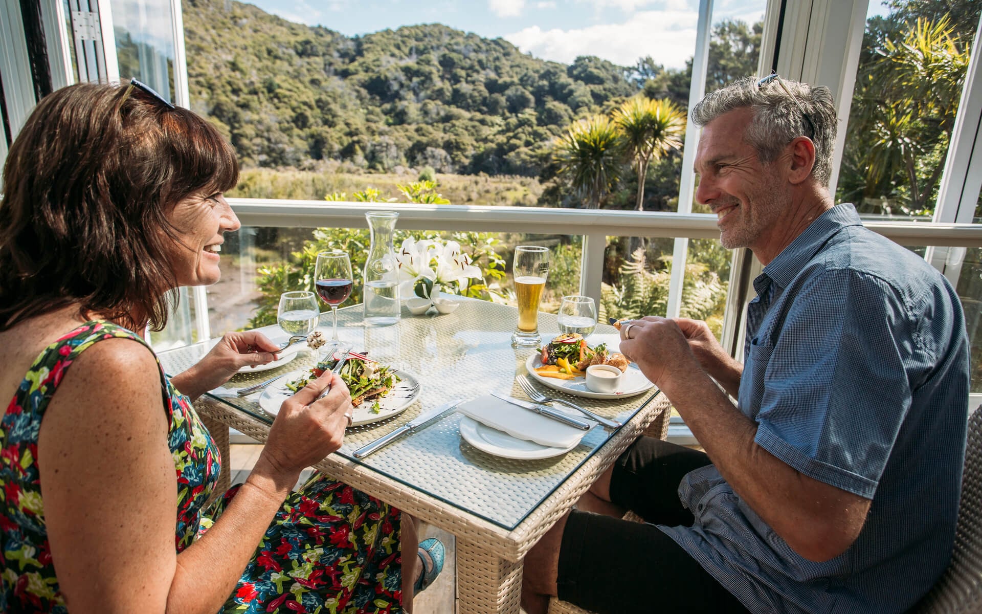 Close up of couple dining at Awaroa Lodge Abel Tasman
