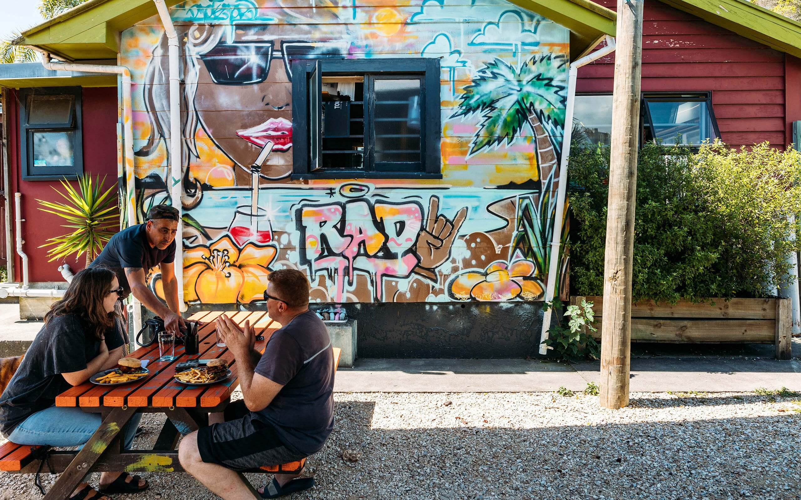 Roots Bar in Tākaka absolutely lives up to its alliterative motto—“beats, beers, burgers, bands”.