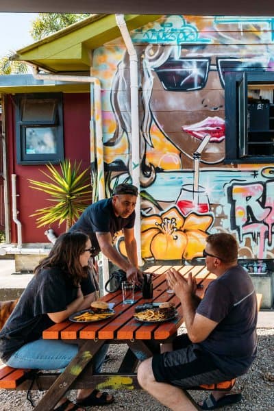 Roots Bar in Tākaka absolutely lives up to its alliterative motto—“beats, beers, burgers, bands”.