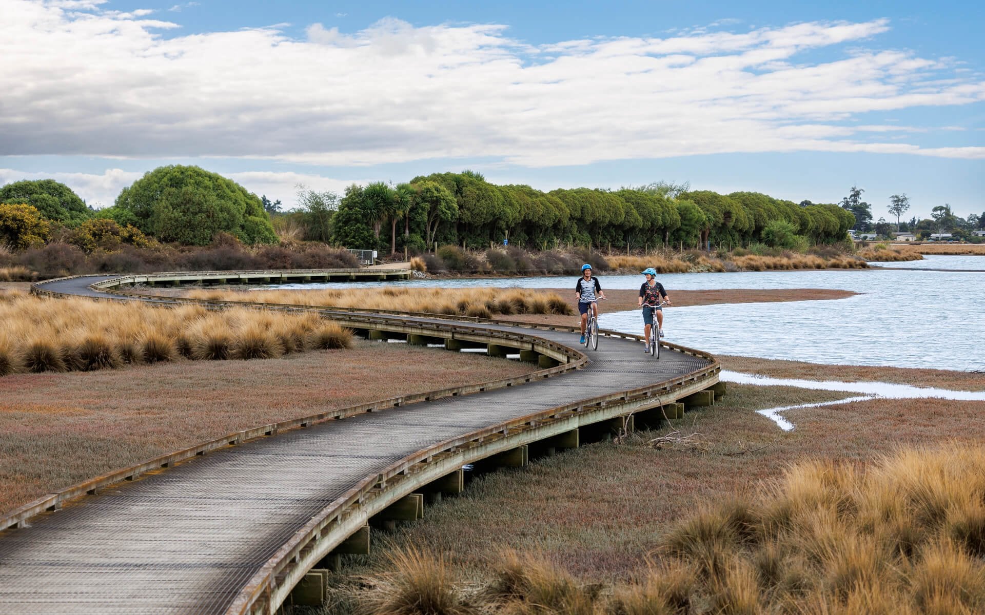 Cruise the trails around Waimea Inlet for a laid-back ride with epic coastal views.