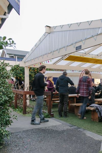The Free House's biergarten is a relaxed spot with plenty of room to unwind and stay warm, thanks to heated pipes under the tables.