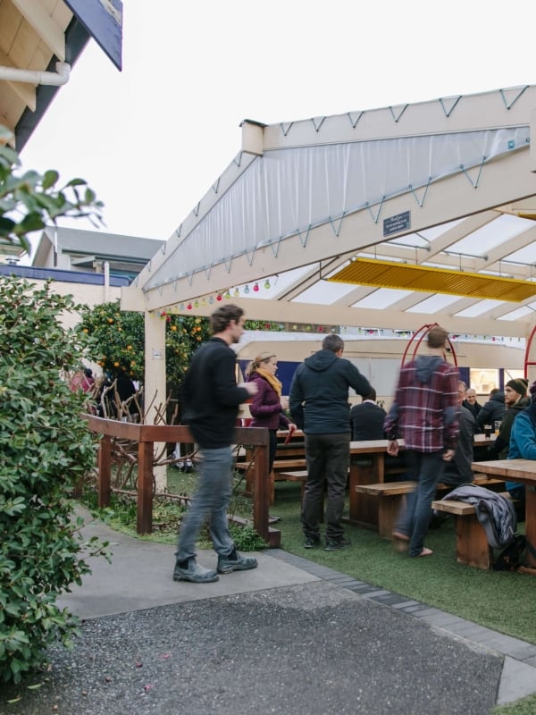 The Free House's biergarten is a relaxed spot with plenty of room to unwind and stay warm, thanks to heated pipes under the tables.