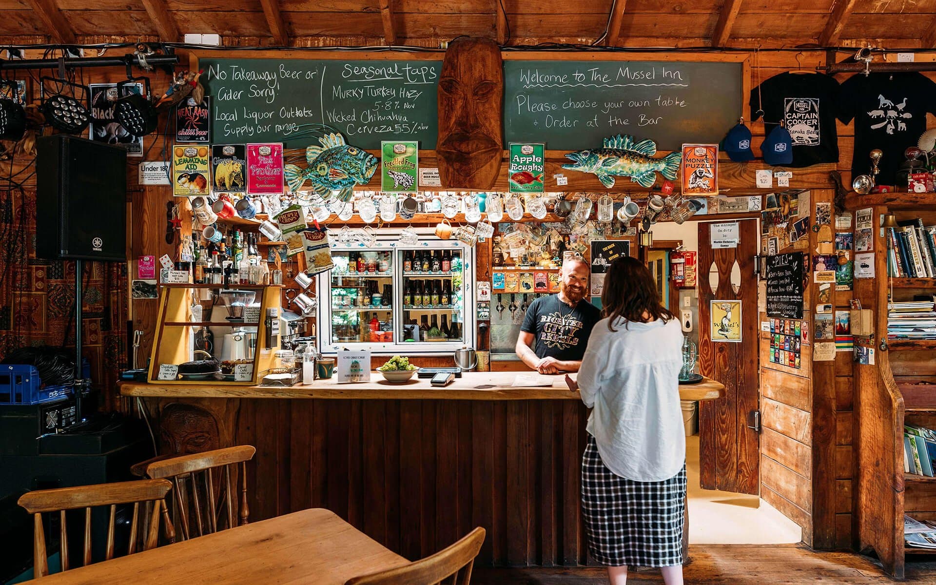 The Mussel Inn is a rustic, beloved spot known for its craft beers, live music, and laid-back vibe, nestled in the heart of Golden Bay.