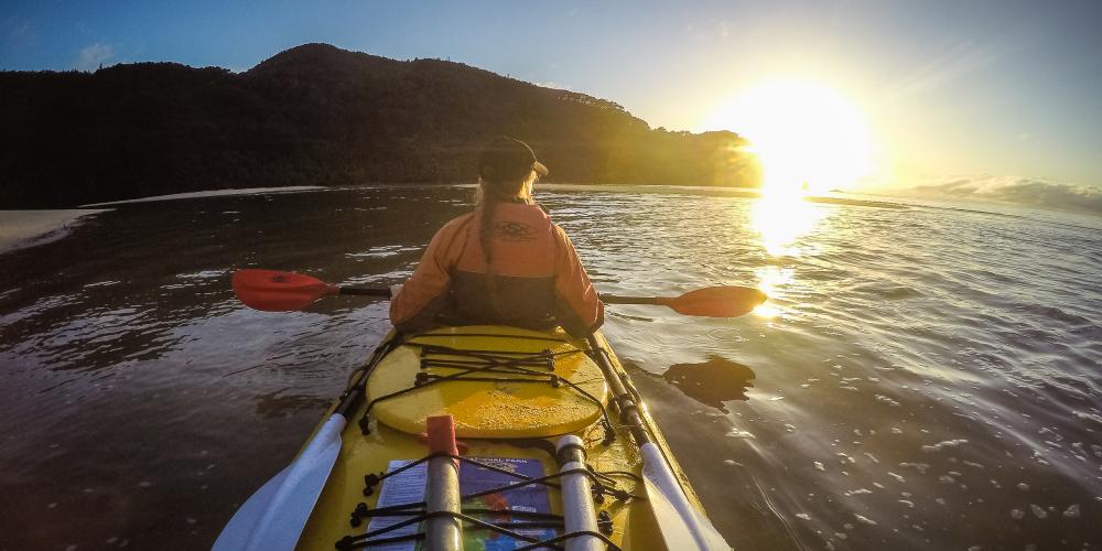 MS kayaking with the sunrise Marahau Sea Kayaks